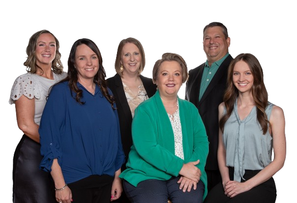 Six adults in smart casual business attire posing together for a group photo.